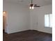 Spacious living room with ceiling fan, a window, and doors at 13024 Ne 6 Pl, Silver Springs, FL 34488
