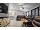 Living room featuring leather sofas, modern lighting, and a tv at 2880 Se 34Th St, Ocala, FL 34471