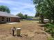 Backyard with a lush green landscape provides a serene outdoor retreat at 3733 Se 137Th Street, Summerfield, FL 34491