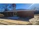 Exterior view of the backyard of the new home with stucco exterior and a concrete patio at 3733 Se 137Th Street, Summerfield, FL 34491