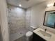 Modern bathroom with a marble-tiled shower, new vanity, and stylish fixtures at 3733 Se 137Th Street, Summerfield, FL 34491