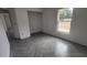 Bright bedroom featuring herringbone-patterned tile flooring and a sunlit window with outside views at 3733 Se 137Th Street, Summerfield, FL 34491