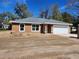 New home featuring stucco exterior, gray roof, white trim, and attached two car garage at 3733 Se 137Th Street, Summerfield, FL 34491