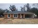 New home featuring stucco exterior, gray roof, white trim, and open garage at 3733 Se 137Th Street, Summerfield, FL 34491