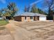 Charming one-story home featuring a two-car garage and manicured lawn at 3733 Se 137Th Street, Summerfield, FL 34491
