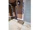 Inviting front entrance with stone accents and well-lit address numbers for a modern look at 3733 Se 137Th Street, Summerfield, FL 34491