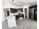 Modern kitchen with stainless steel appliances, sleek cabinetry, and bright countertops at 3733 Se 137Th Street, Summerfield, FL 34491
