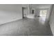Spacious open floor plan with herringbone tile, seamlessly connecting living spaces and filled with light at 3733 Se 137Th Street, Summerfield, FL 34491