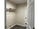 Laundry room with wire shelving and light colored walls at 4131 Se 130Th Pl, Belleview, FL 34420