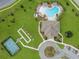Aerial view of community pool, tennis court, bocce ball court, clubhouse, and parking at 6071 Sw 93Rd Loop, Ocala, FL 34476
