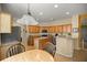 Spacious kitchen featuring an island, stainless steel appliances, and breakfast bar at 7947 Sw 83Rd Pl, Ocala, FL 34476