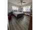 Bedroom with a bed, side tables, and curtains in front of the window at 8152 Sw 106Th St, Ocala, FL 34481