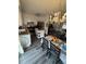A kitchen with an island, stainless steel appliances, white cabinetry and access to the dining area at 8152 Sw 106Th St, Ocala, FL 34481