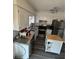A kitchen with an island, stainless steel appliances, white cabinetry and solid surface countertops at 8152 Sw 106Th St, Ocala, FL 34481