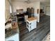 A kitchen with an island, stainless steel appliances, white cabinetry and solid surface countertops at 8152 Sw 106Th St, Ocala, FL 34481