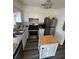 A well-equipped kitchen featuring stainless steel appliances, tiled backsplash, and an island at 8152 Sw 106Th St, Ocala, FL 34481