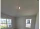 This large bedroom features lots of natural light, tile flooring, and a spacious closet at 8309 Sw 58Th Ave, Ocala, FL 34476