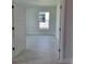 This large bedroom features lots of natural light, tile flooring, and a spacious closet at 8309 Sw 58Th Ave, Ocala, FL 34476