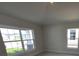 This large bedroom features lots of natural light, tile flooring, and a spacious closet at 8309 Sw 58Th Ave, Ocala, FL 34476