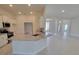 Spacious kitchen with granite countertops and stainless steel appliances overlooks the breakfast nook and living spaces at 8309 Sw 58Th Ave, Ocala, FL 34476