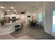 Bright, open kitchen featuring stainless steel appliances, granite countertops, and a dining area with natural light at 8309 Sw 58Th Ave, Ocala, FL 34476