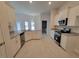 Bright kitchen features white cabinets, stainless steel appliances, and granite countertops at 8309 Sw 58Th Ave, Ocala, FL 34476