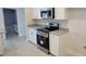 Modern kitchen appliances, including stainless steel oven and microwave, complement white cabinetry at 8309 Sw 58Th Ave, Ocala, FL 34476