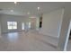 Open-concept living room with tile flooring and natural light from large windows at 8309 Sw 58Th Ave, Ocala, FL 34476