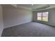 Neutral Primary bedroom with plush carpeting and tray ceiling at 8309 Sw 58Th Ave, Ocala, FL 34476
