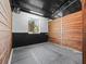 Horse barn stall featuring a dirt floor, block walls, wood planking and window at 965 Nw 73Rd Ter, Ocala, FL 34482