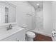 Modern bathroom with white vanity and marble shower at 965 Nw 73Rd Ter, Ocala, FL 34482