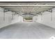 Oversized garage with a metal beam ceiling and a view of the property behind at 965 Nw 73Rd Ter, Ocala, FL 34482