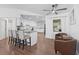 Open concept living room with hardwood flooring, neutral colors, and modern furniture at 965 Nw 73Rd Ter, Ocala, FL 34482