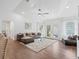 Spacious living room with wood floors, ample light, and comfortable seating arrangement at 965 Nw 73Rd Ter, Ocala, FL 34482