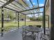 Enjoy outdoor living on this shaded patio with views of the horse pasture at 965 Nw 73Rd Ter, Ocala, FL 34482