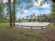 Expansive riding arena with numerous jumps, surrounded by trees at 965 Nw 73Rd Ter, Ocala, FL 34482