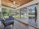 Screened porch with seating and view of property at 965 Nw 73Rd Ter, Ocala, FL 34482