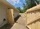 View of the home's backyard with a new wooden fence and gate for added privacy and security at 13441 Sw 113Th Pl, Dunnellon, FL 34432
