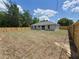 Picture of backyard with lawn featuring an excellent newly built fence that enhances privacy and appeal at 13441 Sw 113Th Pl, Dunnellon, FL 34432