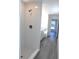 Bathroom with shower, white subway tile, and grey flooring at 13441 Sw 113Th Pl, Dunnellon, FL 34432