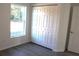 Neat bedroom showcasing a large closet, window and neutral walls with wood-look flooring at 13441 Sw 113Th Pl, Dunnellon, FL 34432