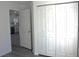 Bedroom with closet and view into kitchen at 13441 Sw 113Th Pl, Dunnellon, FL 34432