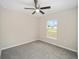 Bright bedroom with carpeted floors and ceiling fan at 15923 Sw 41St Street Rd, Ocala, FL 34481