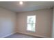 Bedroom with neutral walls and window allowing for natural light at 7695 Sw 103Rd Loop, Ocala, FL 34476