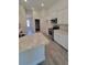 Modern kitchen with granite countertops and stainless steel appliances at 7695 Sw 103Rd Loop, Ocala, FL 34476