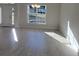 Dining room featuring a chandelier and a large window at 7703 Sw 103Rd Loop, Ocala, FL 34476