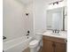 Bathroom with tub, toilet, vanity, and wood-look floors at 9769 Sw 79Th Lane Rd, Ocala, FL 34481