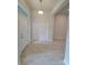Bright entryway features tile flooring, white doors, and a transom window for natural light at 11503 Sw 65Th Avenue Rd, Ocala, FL 34476