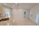 Bright kitchen with modern fixtures, granite countertops, stainless steel sink, and tile flooring at 11503 Sw 65Th Avenue Rd, Ocala, FL 34476