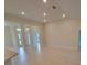Spacious living room with tile floors, recessed lighting and access to other areas at 11503 Sw 65Th Avenue Rd, Ocala, FL 34476